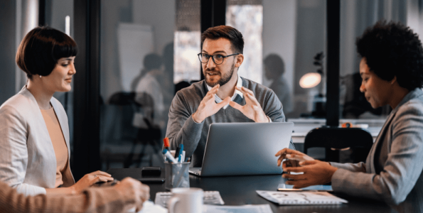 senior-manager-is-sitting-boardroom-with-multiracial-colleagues-discussing-project-1-1-1.png